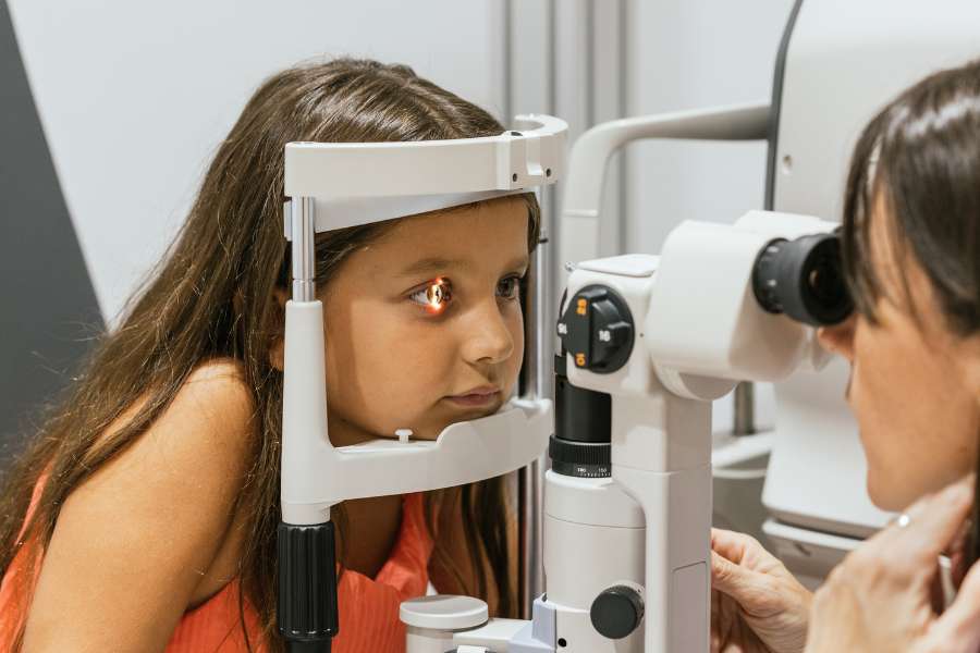 Young Girl Concentrating During Eye Exam