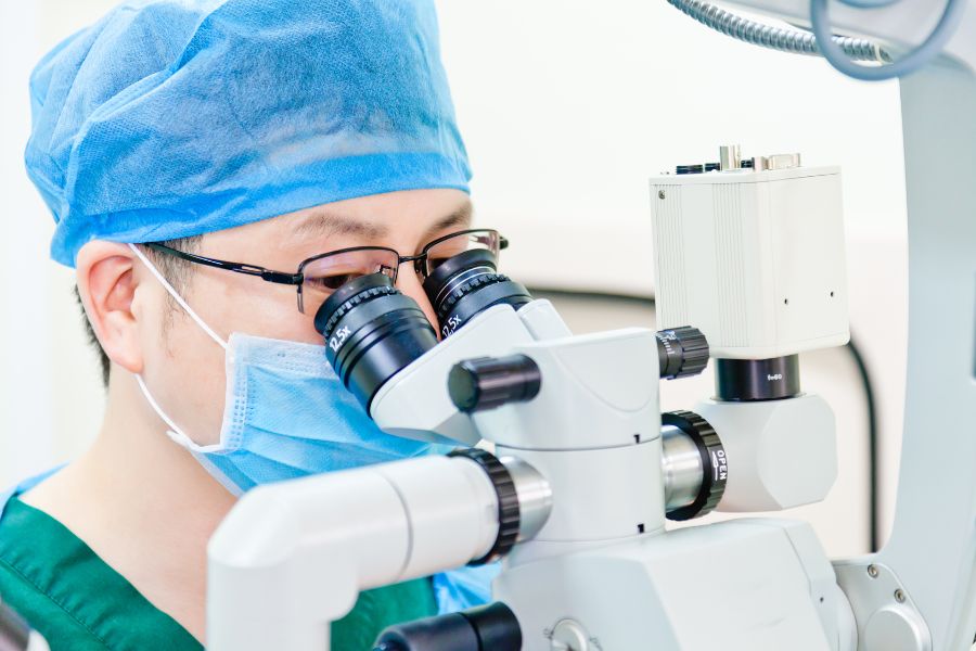 Doctor Using Microscope